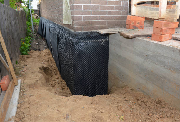Happy homeowners after waterproofing job in Roanoke